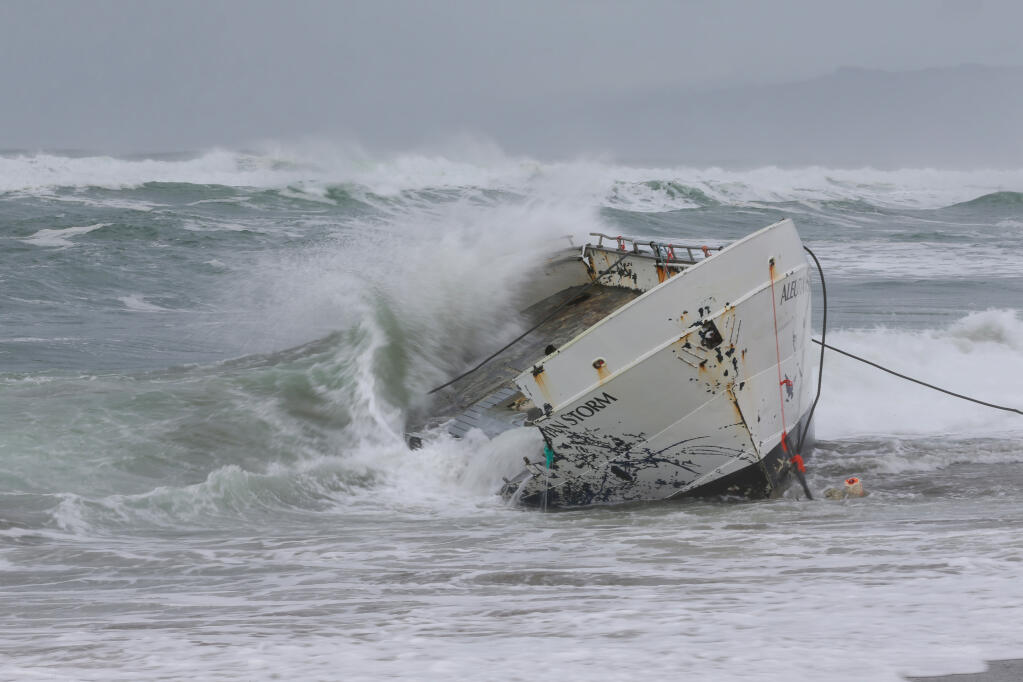 Waves crash over the remaining hull of the Aleutian Storm along the shore of south Salmon Creek State Beach, north of Bodega Bay, Tuesday, Feb. 20, 2024. (Christopher Chung/The Press Democrat)