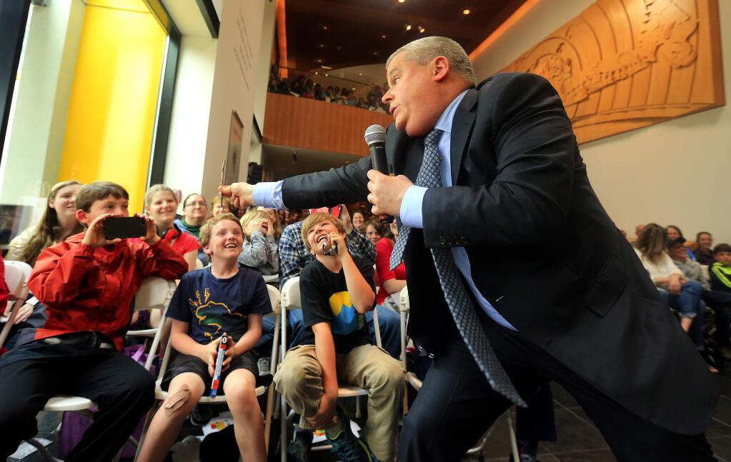 Daniel Handler, aka Lemony Snicket, scares and delights his young fans during a talk about his 'A Series of Unfortunate Events' books to a large crowd of fans at the Charles M. Schulz museum on Saturday, March 18, 2017. (John Burgess/The Press Democrat)