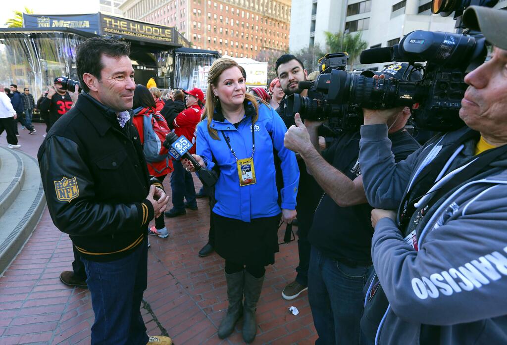 Super Bowl host committee CEO Keith Bruce talks to local TV stations at the opening of Super Bowl City on Saturday, January 30, 2016. (JOHN BURGESS / The Press Democrat)
