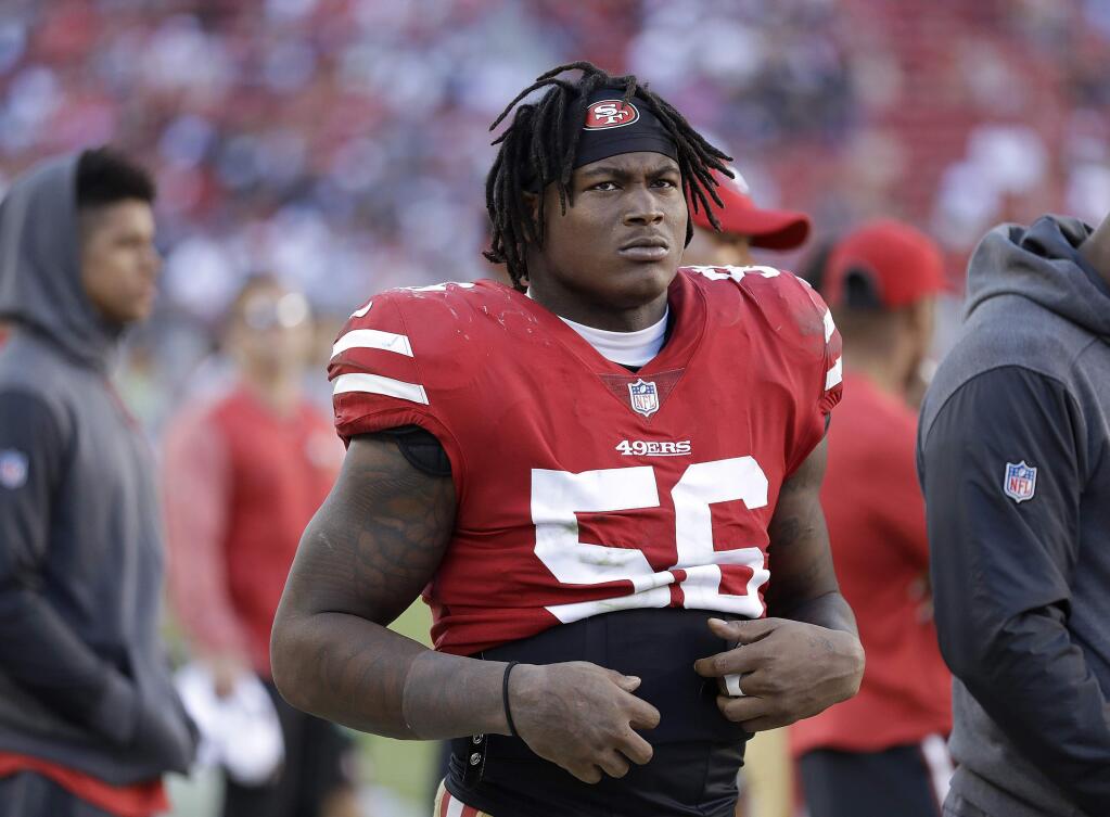 In this Oct. 22, 2017, file photo, San Francisco 49ers linebacker Reuben Foster stands on the sideline during a game against the Dallas Cowboys in Santa Clara. A Santa Clara County judge has ruled that Foster will not have to stand trial on domestic violence charges after the accuser recanted her allegations at a preliminary hearing, Wednesday, May 23, 2018. (AP Photo/Marcio Jose Sanchez, File)