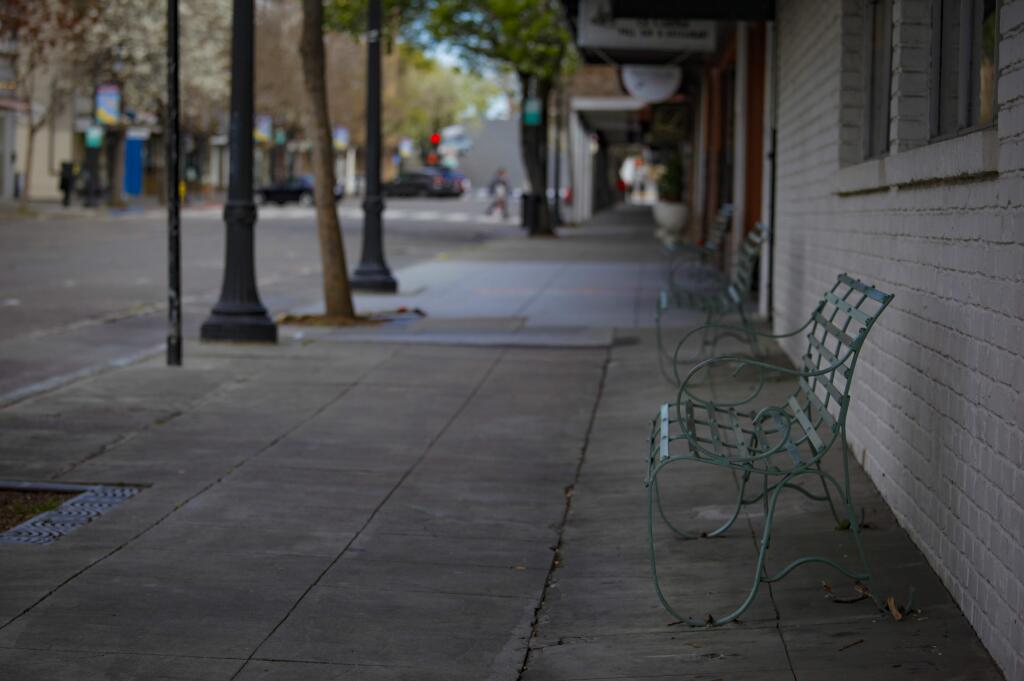 Petaluma, CA, USA. Monday, March 23, 2020._ The empty Kentucky Street sidewalk depicts life in Petaluma during the “shelter in place” order due to the COVID-19 pandemic. Non-essential businesses are forced to close and restaurants can remain open for take out or delivery. (CRISSY PASCUAL/ARGUS-COURIER STAFF)
