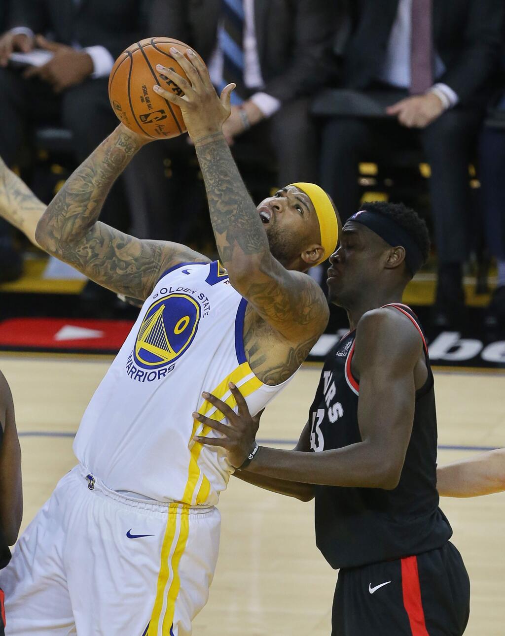 Golden State Warriors center DeMarcus Cousins is fouled by Toronto Raptors forward Pascal Siakam while making a basket during game 3 of the NBA Finals in Oakland on Wednesday, June 5, 2019. (Christopher Chung/ The Press Democrat)