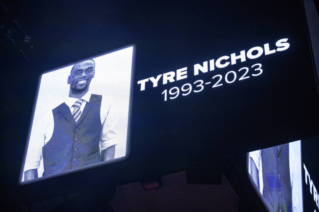 FILE - The screen at the Smoothie King Center in New Orleans honors Tyre Nichols before an NBA basketball game between the New Orleans Pelicans and the Washington Wizards, Jan. 28, 2023. Five former Memphis, Tenn., police officers were scheduled Friday, Feb. 17, to make their first court appearance on murder and other charges in the violent arrest and death of Nichols. (AP Photo/Matthew Hinton, File)