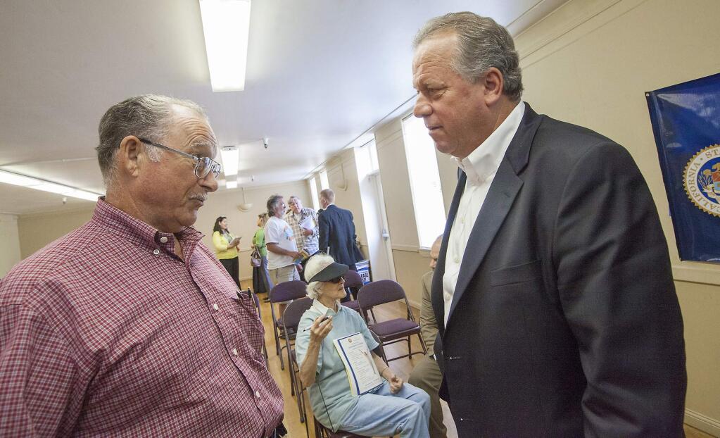 Bob Piazza (left) spoke with Assemblymember Bill Dodd, who has himself been victimized by identity theft, after the Fraud Prevention Town Hall held at the Sonoma Community Center on Wednesday, September 21. (Photo by Robbi Pengelly/Index-Tribune)