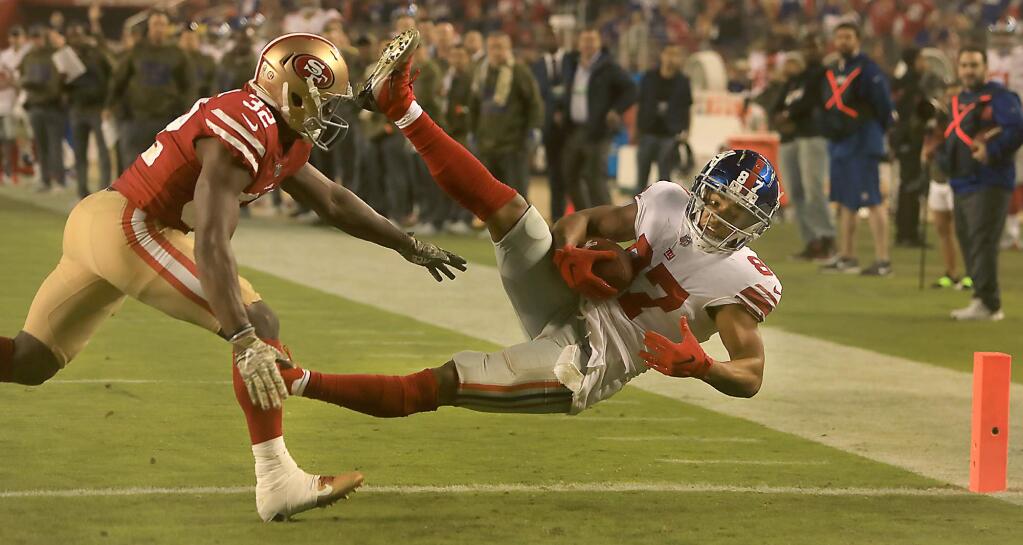 Sterling Shepard of the Giants falls in to the end zone for the game winning score past 49ers defender D.J. Reed Jr., during San Francisco's 27-23 loss over New York, Monday, Nov. 12, 2018. (Kent Porter / The Press Democrat) 2018