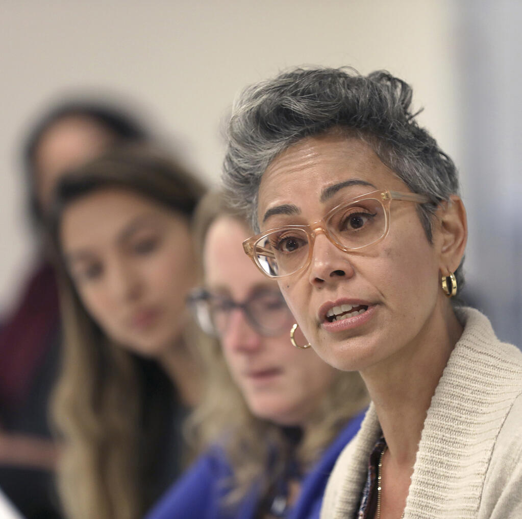 Alison Collins, right, is seen in this Sept. 26, 2018 photo during an editorial board meeting, in San Francisco, Calif. Collins the vice president of San Francisco’s school board is under fire for tweets she wrote in 2016 that said Asian Americans use “white supremacist” thinking to get ahead and were racist toward Black students. (Liz Hafalia/San Francisco Chronicle via AP)