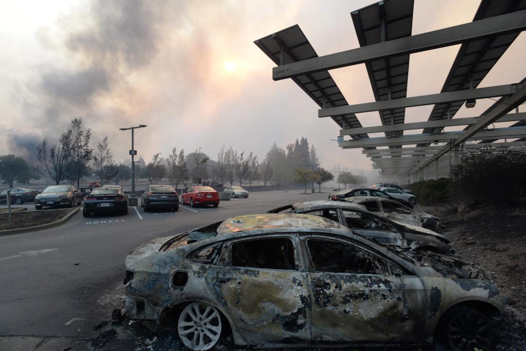 Charred cars in the parking lot at Keysight Technologies in the Fountaingrove neighborhood of Santa Rosa, California Monday. October 9, 2017.(Photo: Erik Castro/for The Press Democrat)