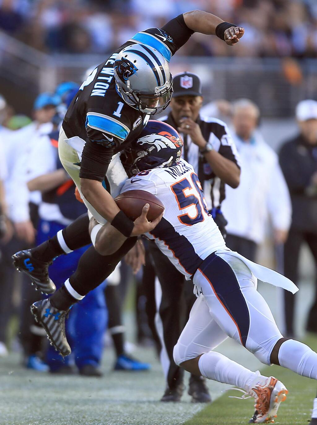 Cam Newton of the Panthers is tackled out of bounds by Von Miller of the Broncos during Super Bowl 50, Sunday Feb. 7, 2016 at Levi's Stadium in Santa Clara. (Kent Porter / Press Democrat ) 2016