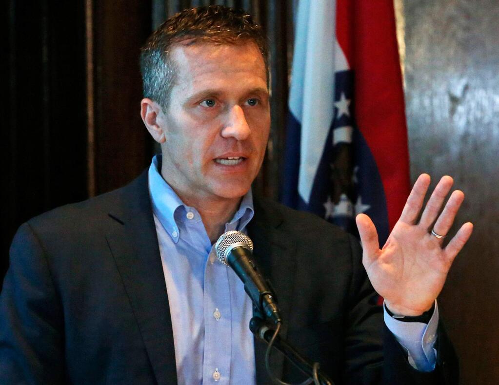 FILE - In this April 11, 2018 file photo, Missouri Gov. Eric Greitens speaks at a news conference in Jefferson City, Mo., about allegations related to an extramarital affair with his hairdresser. Missouri Attorney General Josh Hawley said Tuesday, April 17, 2018, he believes there's enough evidence to bring a criminal charge and pursue impeachment of Gov. Eric Greitens for allegedly using a charity donor list for political purposes. (J.B. Forbes/St. Louis Post-Dispatch via AP, File)