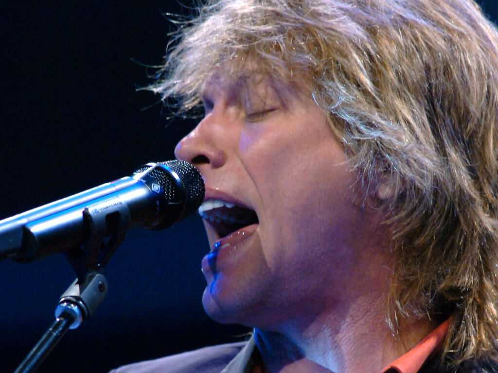 FILE- Singer Jon Bon Jovi performs during the Wal-Mart Stores Inc. shareholders' meeting in Fayetteville, Ark., Friday, June 3, 2005. (AP Photo/April L. Brown)