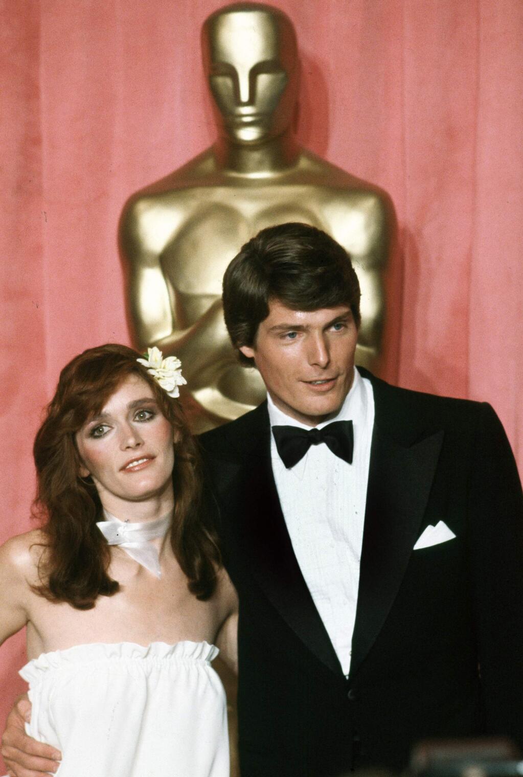 FILE - In this April 9, 1979 file photo, actress Margot Kidder, left, and actor Christopher Reeve appear at the 51st Annual Academy Awards ceremony in Los Angeles. Kidder, who starred as Lois Lane in the “Superman” film franchise of the late 1970s and early 1980s, has died. Franzen-Davis Funeral Home in Livingston, Montana posted a notice on its website saying Kidder died Sunday, May 13, 2918, at her home there. She was 69. (AP Photo/Reed Saxon, File)