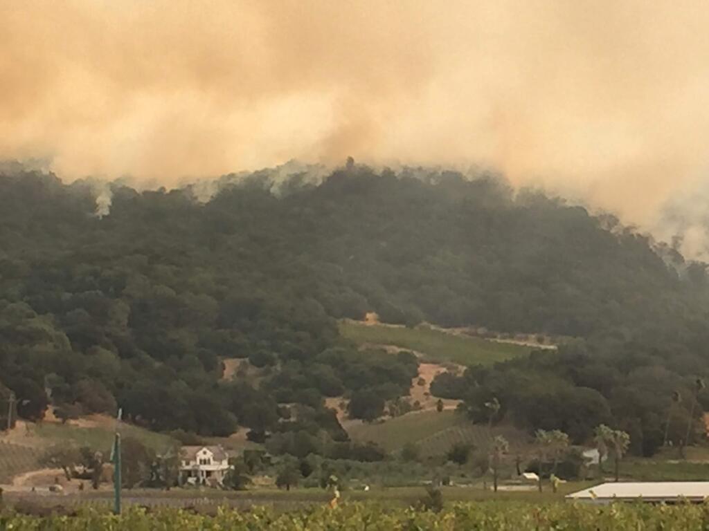 A view of the fire raging behind Gundlach-Bundschu. There is concern the fire is also heading down the back side of the mountain closer to town.