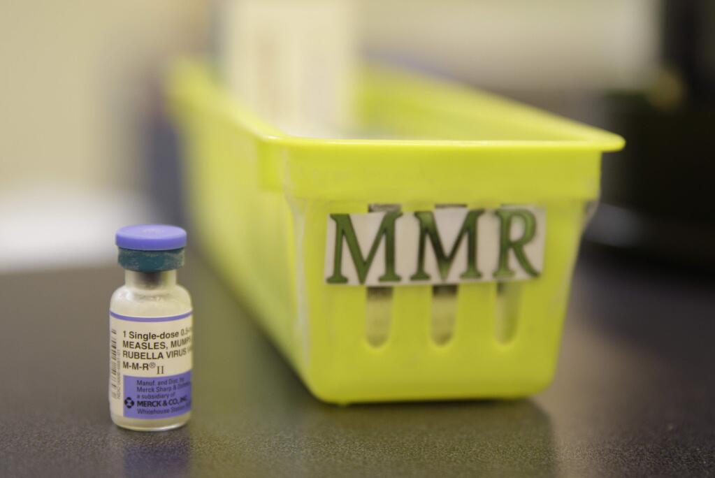 This file photo shows a measles, mumps and rubella vaccine on a countertop at a pediatrics clinic (AP Photo/Eric Risberg, File)