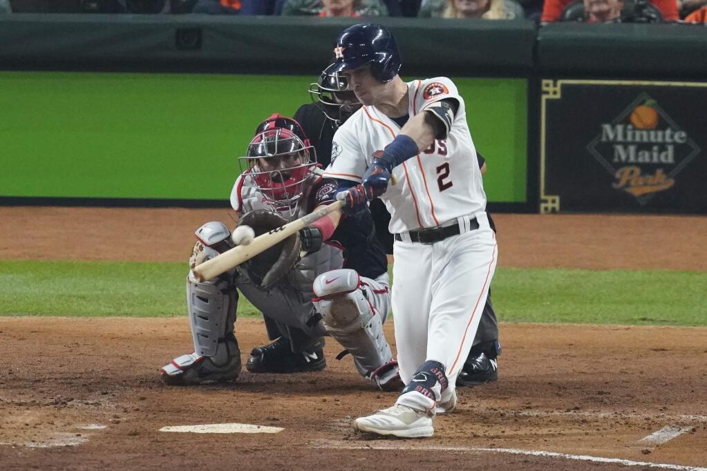 Houston Astros' Alex Bregman hits a two-run home run during the first inning of Game 2 of the baseball World Series against the Washington Nationals Wednesday, Oct. 23, 2019, in Houston. (AP Photo/Eric Gay)