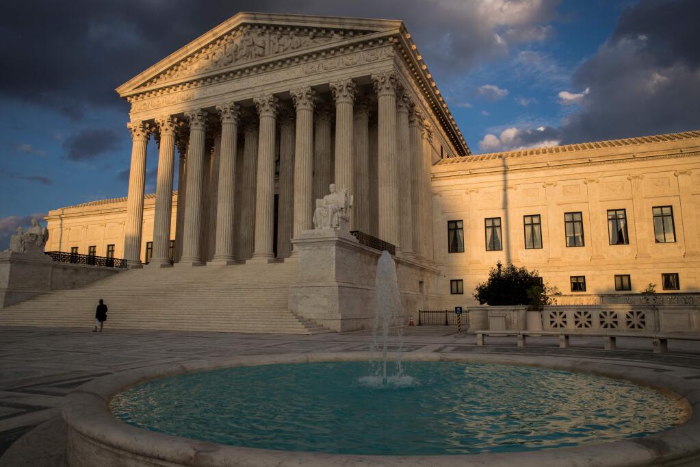 In this Oct. 10, 2017 photo, the Supreme Court in Washington is seen at sunset. (AP Photo/J. Scott Applewhite)
