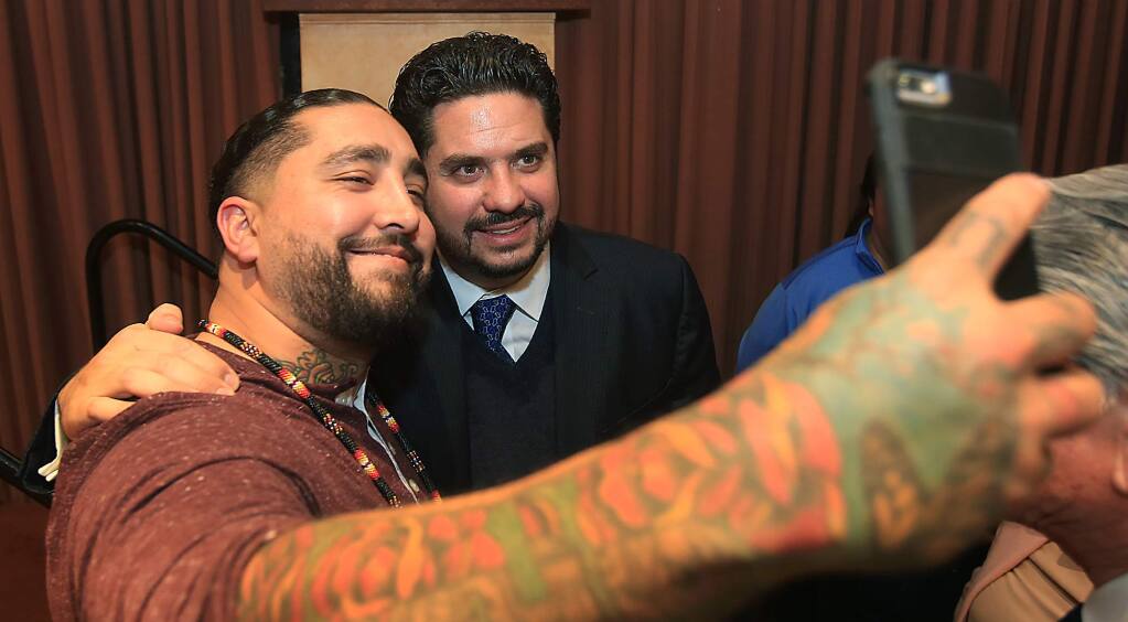 City of Santa Rosa community outreach specialist Salavdor Sanchez, left, takes a photo with Mexico's Consul General Gemi Jose Gonzalez, after Gonzalez gave the keynote address during a Los Cien meeting at the Flamingo Resort and Hotel in Santa Rosa, Friday Jan. 27, 2017. (Kent Porter / The Press Democrat) 2017