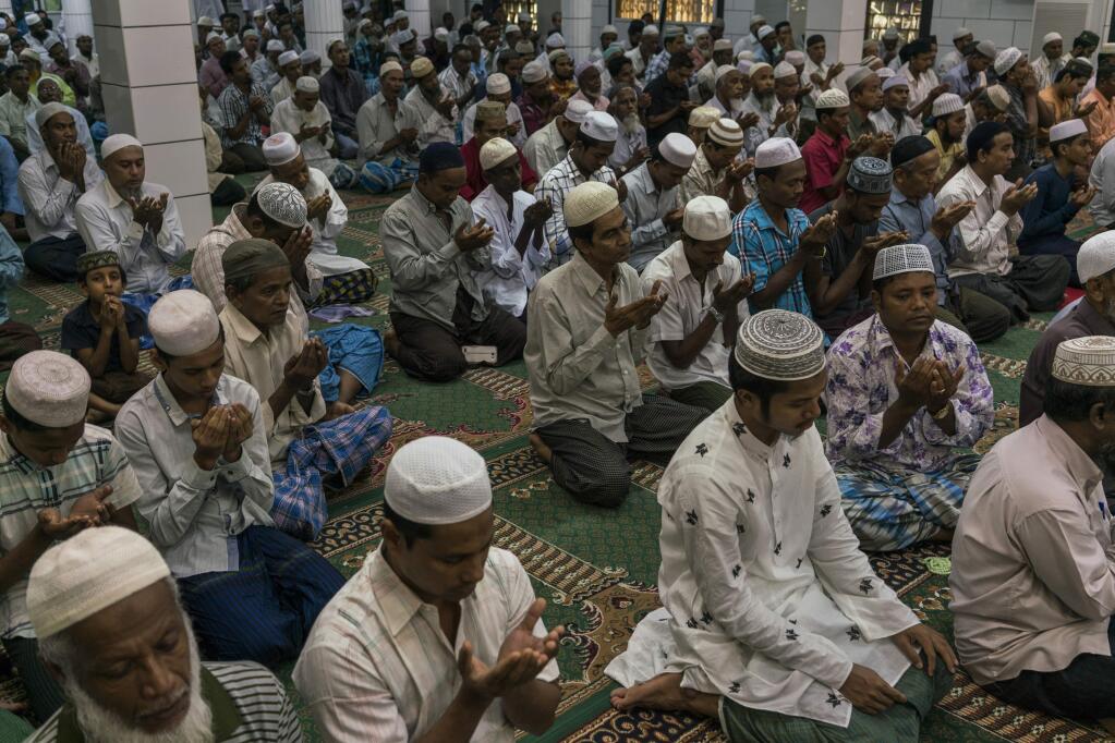 FILE -- Men pray at a mosque in Yangon, Myanmar, Oct. 8, 2017. (Adam Dean/The New York Times)