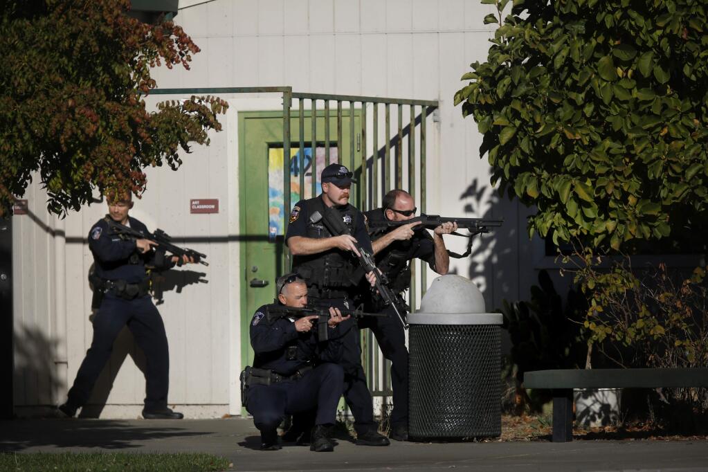 Santa Rosa police search the campus of Ridgway High School for suspects after a shooting at the school in Santa Rosa on Tuesday, October 22, 2019. (BETH SCHLANKER/ The Press Democrat)