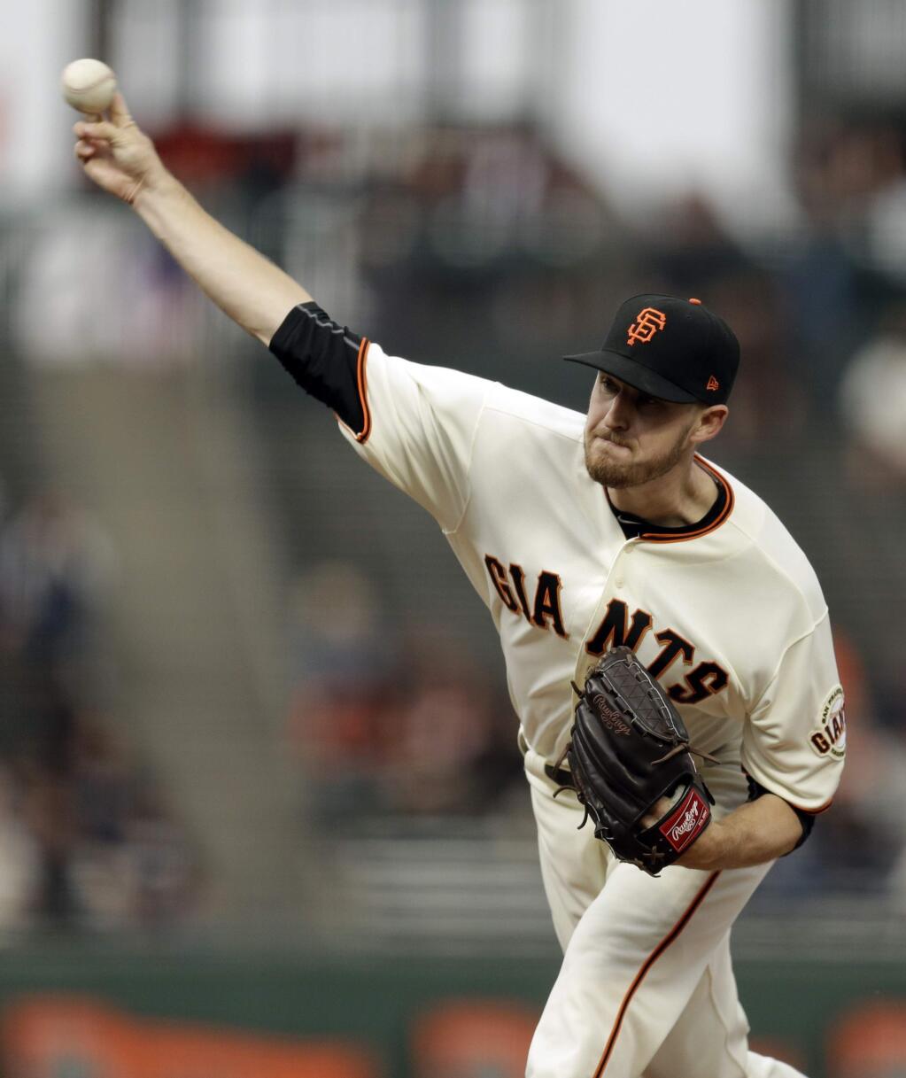 San Francisco Giants pitcher Chris Stratton works against the Milwaukee Brewers in the first inning of a baseball game Monday, Aug. 21, 2017, in San Francisco. (AP Photo/Ben Margot)