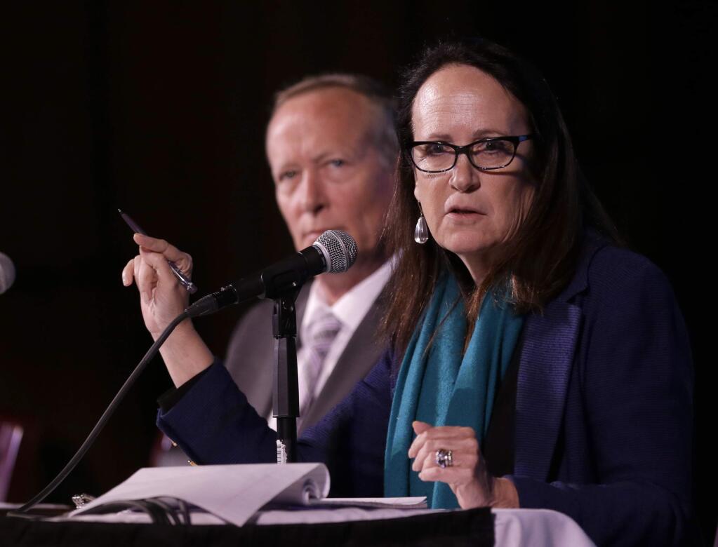 Felicia Marcus, chairwoman of the State Water Resources Control Board discusses some of the water efficiency measures being proposed during a drought briefing in Sacramento, Calif., Thursday, April 9, 2015. Gov. Jerry Brown has ordered sweeping measures to save water as California deals with fourth year of a drought. At left is Kevin Hunting, chief deputy director of the California Department of Fish and Game.(AP Photo/Rich Pedroncelli)