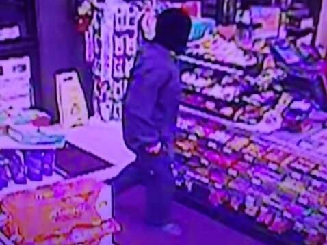 A still from a surveillance video shows a man holding up a convenience store in Petaluma on Tuesday, March 31, 2015. (PETALUMA POLICE DEPARTMENT)