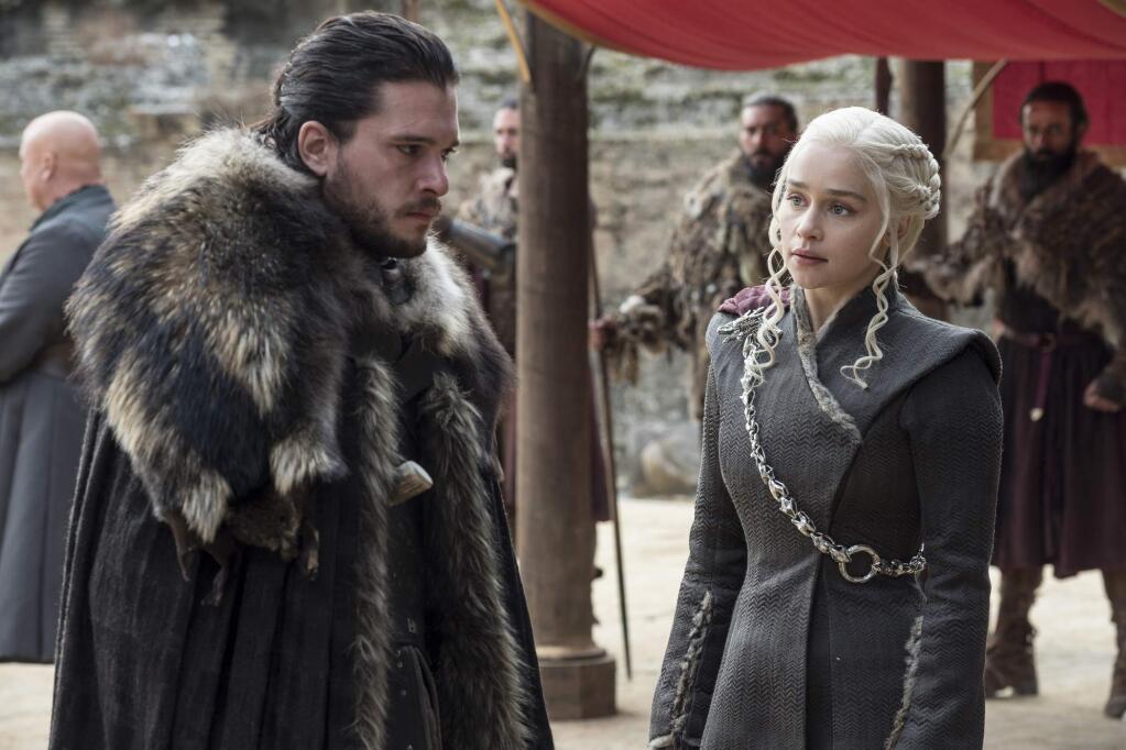This image released by HBO shows Kit Harington, left, and Emilia Clarke on the season finale of 'Game of Thrones.' The eighth and last season of 'Game of Thrones' finally has a date with destiny. HBO said Tuesday, Nov. 13, 2018, that the series will return in April 2019 with six episodes to conclude its run. (Macall B. Polay/HBO via AP)