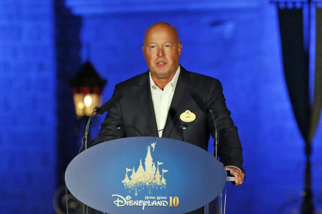 FILE - In this Sept. 11, 2015, file photo, Chairman of Walt Disney Parks and Resorts Bob Chapek speaks during a ceremony at the Hong Kong Disneyland, as he celebrates the Hong Kong Disneyland's 10th anniversary. The Walt Disney Co. has named Bob Chapek CEO, replacing Bob Iger, effective immediately, the company announced Tuesday, Feb. 25, 2020. (AP Photo/Kin Cheung, File)