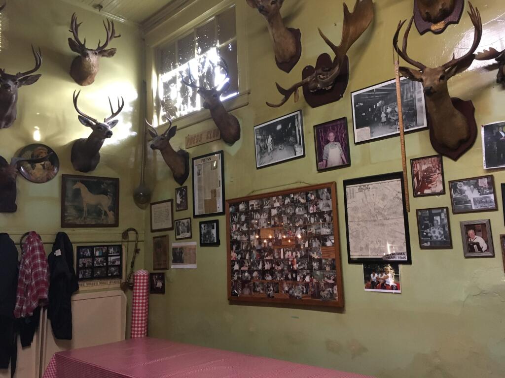 MEASURING UP: Hunting trophies are just one of many old-school touches at Volpi's Bar. Note the yardstick hanging from the deer on the right. PHOTO BY DAVID TEMPLETON