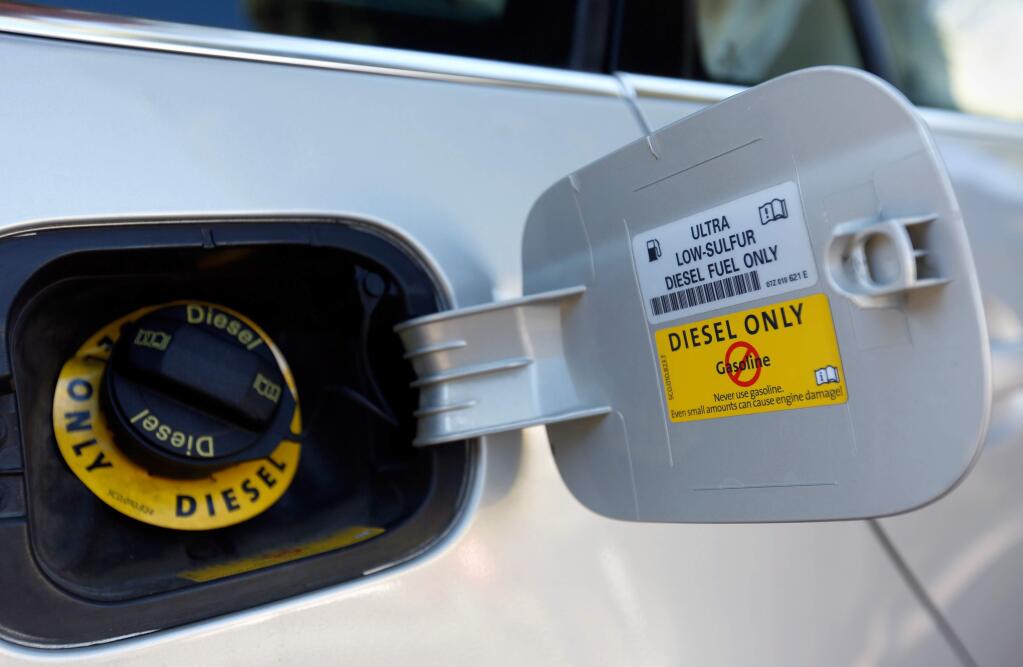 A manufacturer's sticker states, 'Ultra low-sulfur diesel fuel only,' on the fuel intake door of Barbara Bozman-Moss' 2010 Volkswagen Jetta TDI wagon in Santa Rosa, California on Friday, October 2, 2015. Bozman-Moss and her husband are plaintiffs in a lawsuit alleging they are victims of fraud as a result of Volkswagen's emissions scandal. (Alvin Jornada / The Press Democrat)