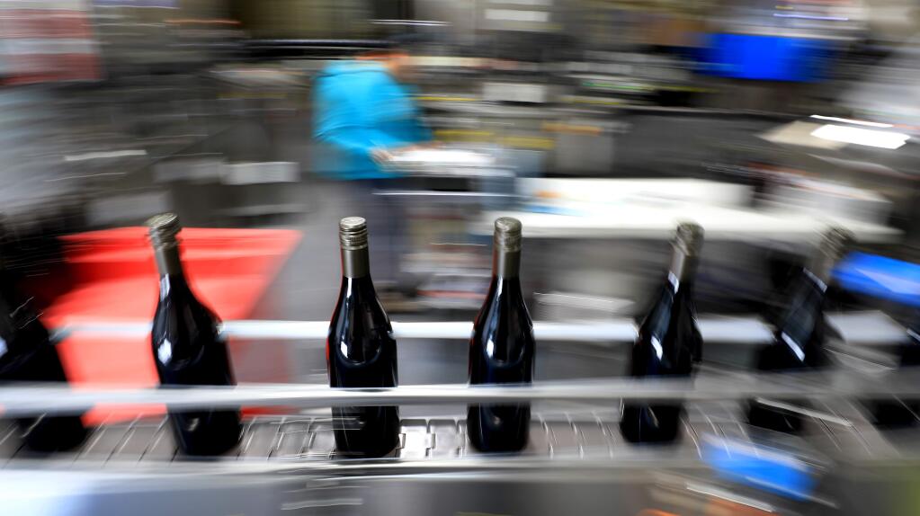 Bottling line in operation, April 2019. A recent outbreak of coronavirus cases in a Sonoma Valley winery has the health department looking at conditions and contacts. (Kent Porter / The Press Democrat)