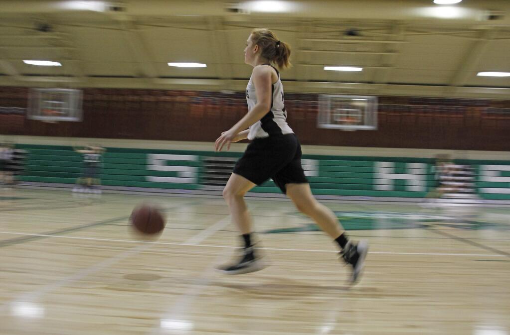 Bill Hoban/Index-TribuneAmy Stanfield dribbles up court during a Lady Dragon practice last Friday. Stanfield is one of five returning players on Coach Jann thorpe's team.