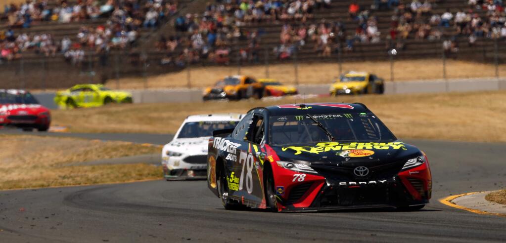 Martin Truex Jr. (78), driving the 5-hour Energy Toyota, speeds through the Turn 8 esses during the Monster Energy NASCAR Cup Series Toyota/Save Mart 350 race at Sonoma Raceway, in Sonoma, California, on Sunday, June 24, 2018. Truex would go on to win the race, making his third win this year. (Alvin Jornada / The Press Democrat)