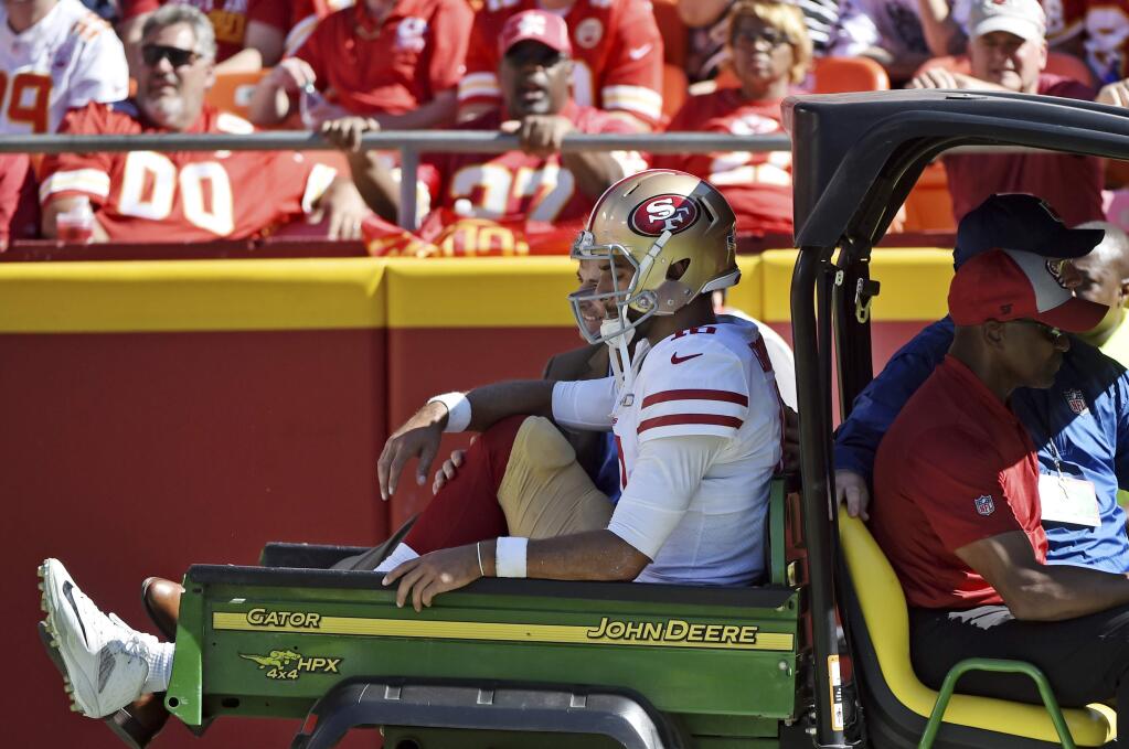 San Francisco 49ers quarterback Jimmy Garoppolo (10) is carted off the field following a tackle by Kansas City Chiefs defensive back Steven Nelson during the second half of an NFL football game in Kansas City, Mo., Sunday, Sept. 23, 2018. Kansas City Chiefs won 38-27. (AP Photo/Ed Zurga)