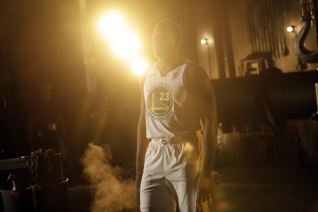 Golden State Warriors forward Draymond Green takes part in a video promo during NBA basketball team media day Friday, Sept. 22, 2017, in Oakland, Calif. (AP Photo/Marcio Jose Sanchez)