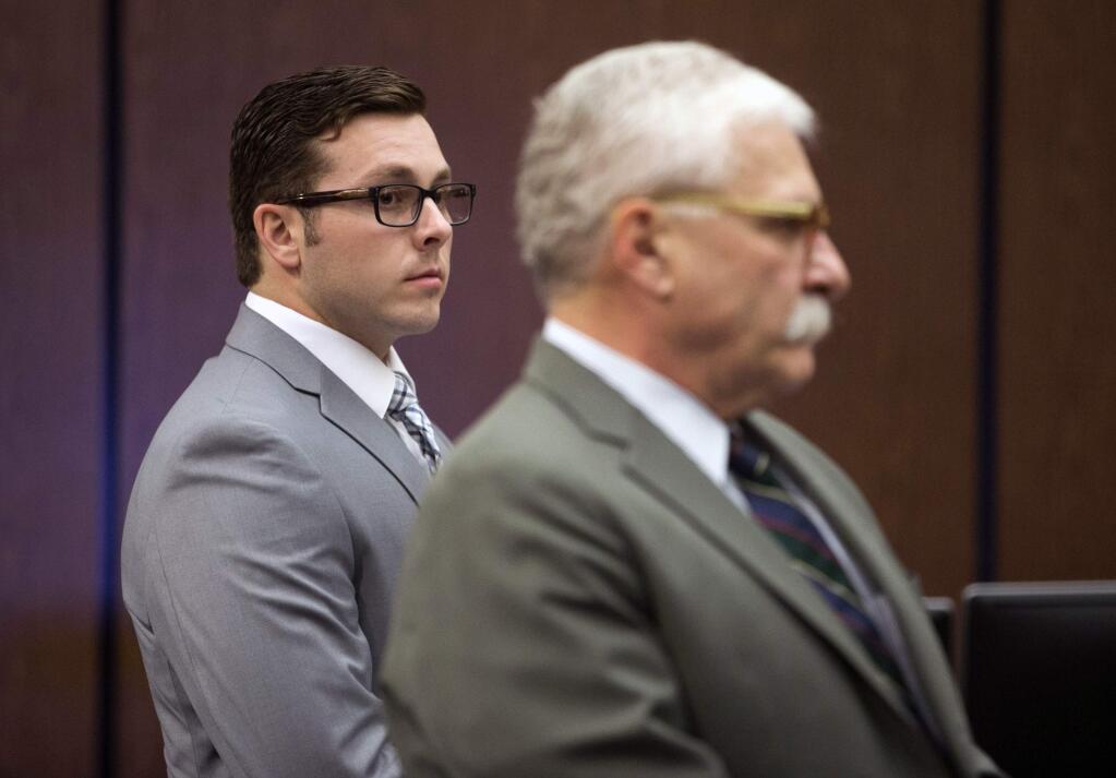 In this Oct. 25, 2017 file photo, former Mesa police officer Philip Brailsford, left, and his attorney, Mike Piccarreta, stand for the jury, at the start of Brailsford's murder trial at Maricopa County Superior Court in Phoenix. (David Wallace/The Arizona Republic via AP, File)