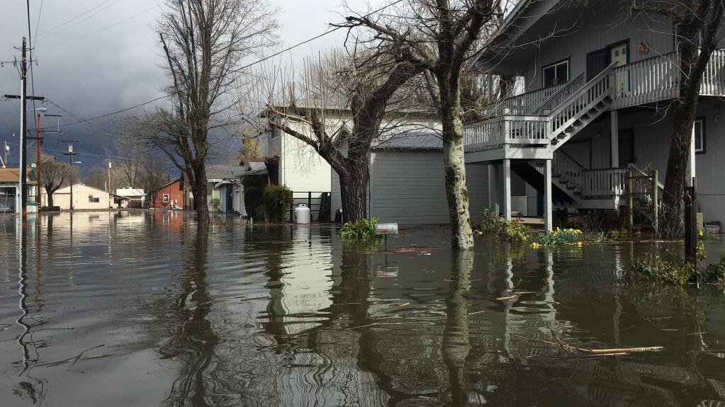 Flooding on Esplanade Street in Lakeport, Tuesday, Feb. 21, 2017. (Kent Porter / Press Democrat)