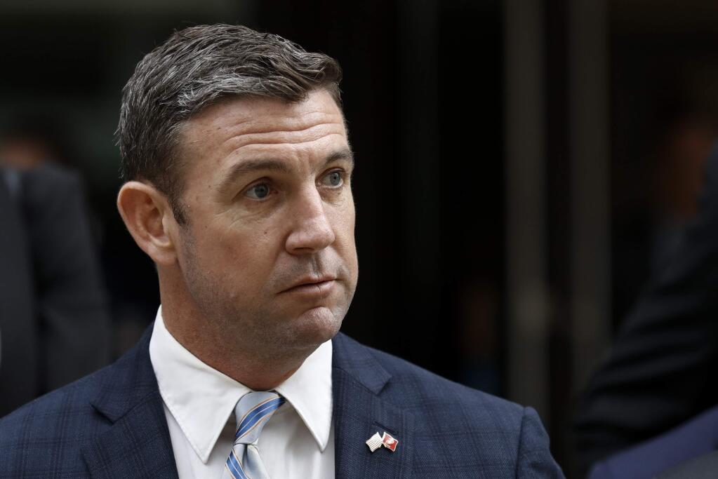 California Republican Rep. Duncan Hunter leaves federal court Tuesday, Dec. 3, 2019, in San Diego. Hunter gave up his year-long fight against federal corruption charges and pleaded guilty Tuesday to misusing his campaign funds, paving the way for the six-term Republican to step down. (AP Photo/Gregory Bull)