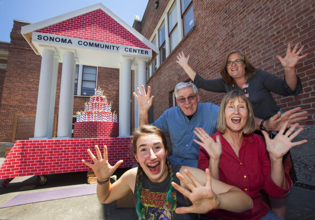 Robbi Pengelly/Index-TribuneCelebrating 100 years, the Sonoma Community Center float - those responsible for its existence are: (bottom) Hannah Ford-Monroe, volunteer; (middle) Jack Lundgren, builder; Margaret Hatcher, SCC special projects manager; (top) Mary Catherine Cutcliffe, event manager