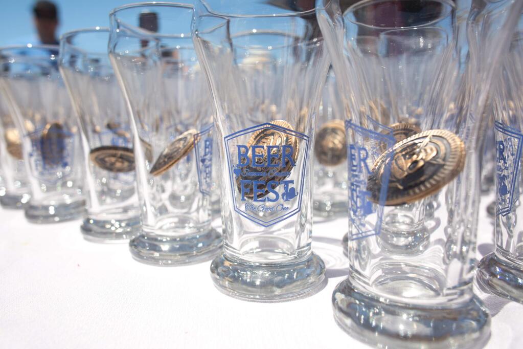 Glasses line the entrance table during the 2015 Sonoma County Beerfest in Santa Rosa Saturday, June 6, 2015.