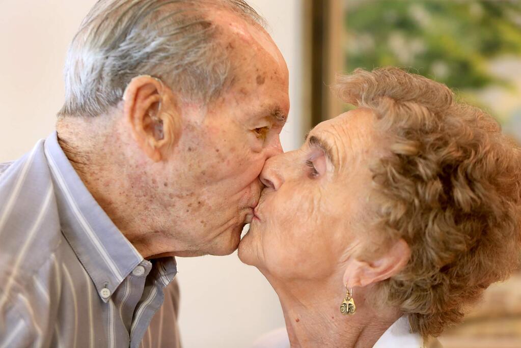 Calvin, 96, and Gladys Purvis, 93 smooch, Monday July 27, 2015 in Santa Rosa. The two will be celebrating their 75th wedding anniversary this week. (Kent Porter / Press Democrat) 2015