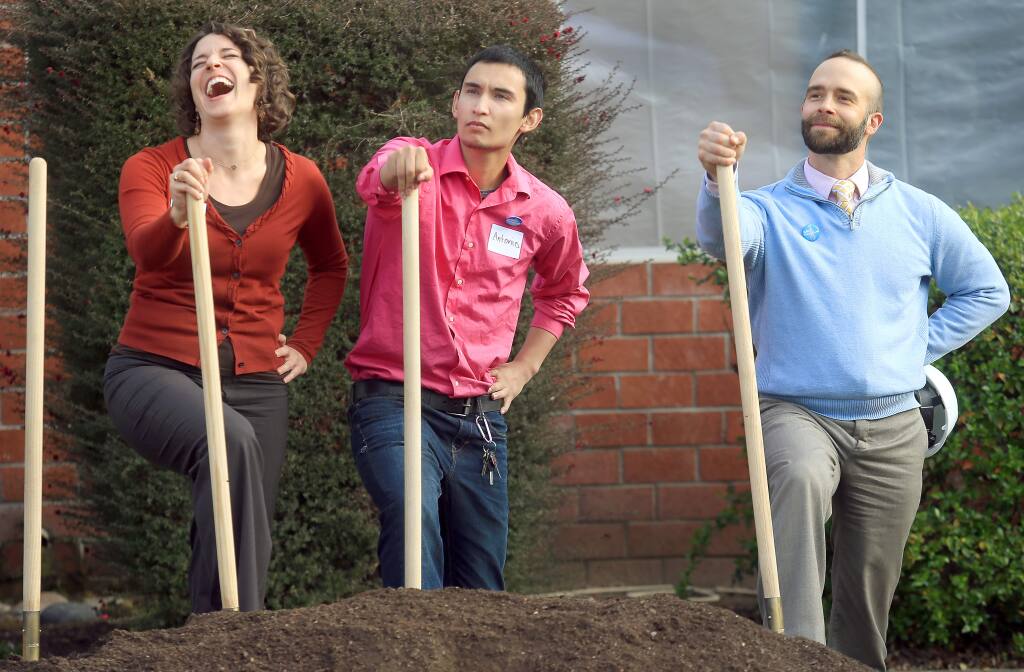 From left, Social Advocates for Youth Chief Development Officer Cat Cvengros busts up while posing for a photo with SAY client Antonio Suttie and SAY Executive Director Matt Martin on Wednesday, March 11, 2015 at the official groundbreaking of the Dream Center in Santa Rosa. (KENT PORTER/ PD)