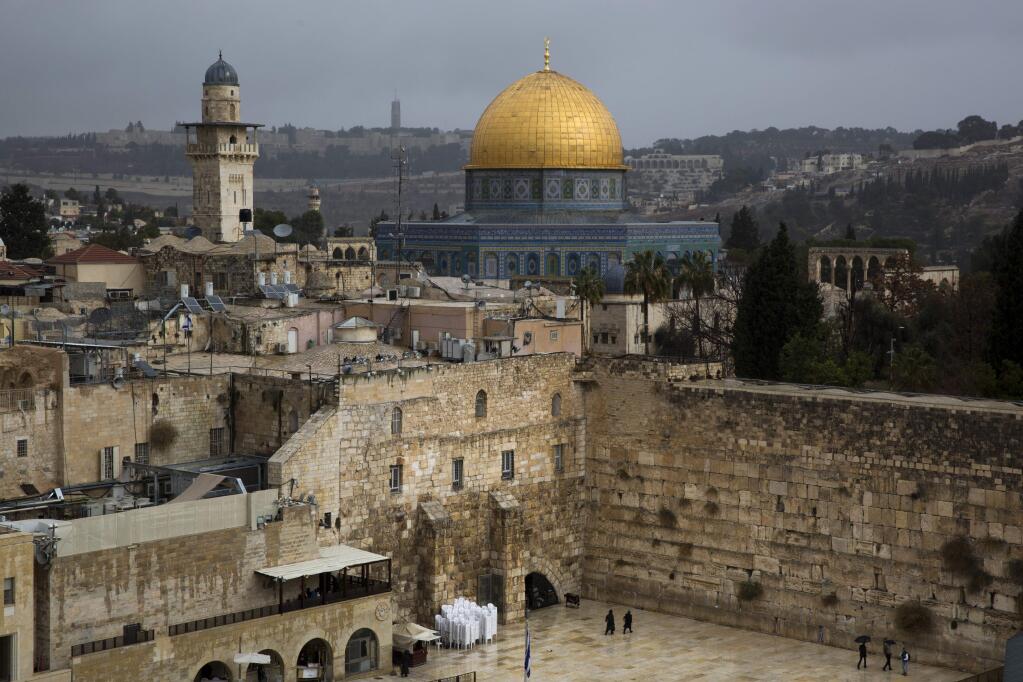 A view of the Western Wall and the Dome of the Rock, some of the holiest sites for for Jews and Muslims, is seen in Jerusalem's Old City, Wednesday, Dec. 6, 2017. U.S. officials say President Donald Trump will recognize Jerusalem as Israel's capital Wednesday, Dec. 6, and instruct the State Department to begin the multi-year process of moving the American embassy from Tel Aviv to the holy city. His decision could have deep repercussions across the region. (AP Photo/Oded Balilty)