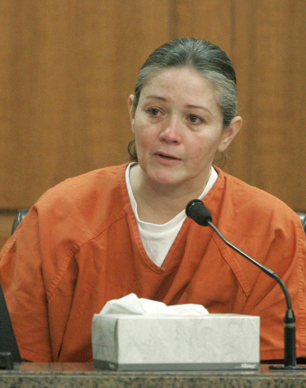 FILE - In this Jan. 16, 2007, file photo, convicted murderer Clara Harris takes the stand in Houston, during a wrongful-death civil suit against her. The Texas woman who killed her cheating husband by running him down with her car in a jealous rage has been released from prison. Sixty-year-old Harris left prison Friday, May 11, 2018, after serving 15 years of a 20-year sentence in the death of her orthodontist husband in 2002 in the parking lot of a suburban Houston hotel. (AP Photo/Pat Sullivan, File)