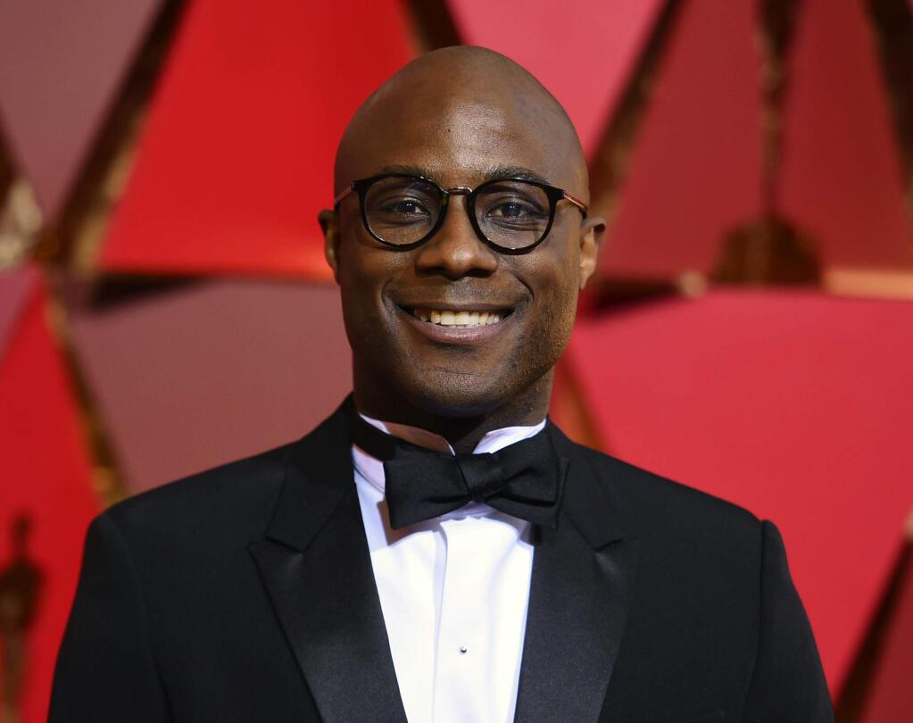 FILE - In this Feb. 26, 2017 file photo, Barry Jenkins arrives at the Oscars in Los Angeles. Jenkins will follow up his Oscar winning film with a drama series for Amazon based on Colson Whitehead's “The Underground Railroad.” Amazon announced Monday, March 27, 2017, that it will develop the TV series, with Jenkins writing and directing the adaptation of the 2016 National Book Award winner. (Photo by Richard Shotwell/Invision/AP, File)