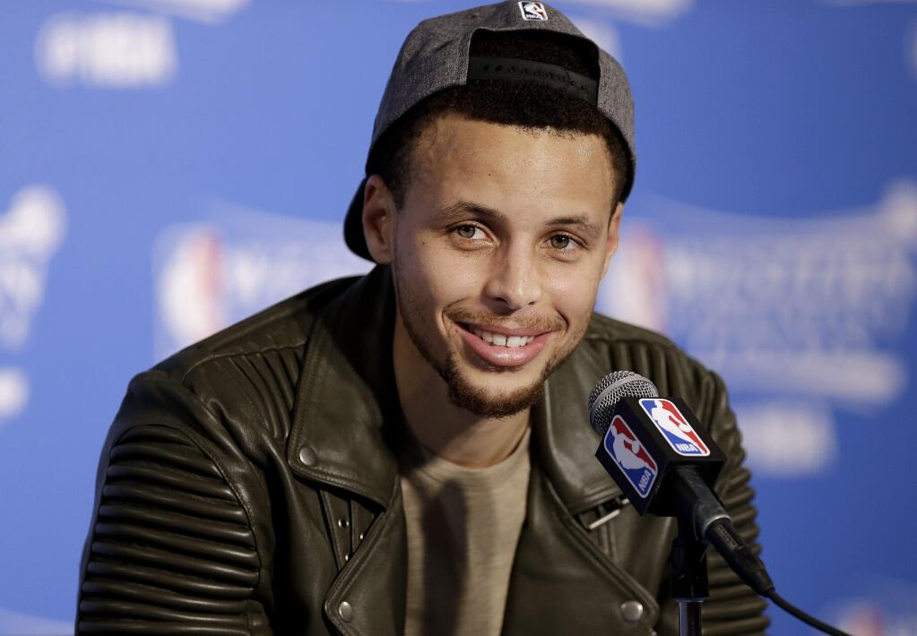 Golden State Warriors guard Stephen Curry smiles during a news conference after Game 7 of the NBA basketball Western Conference finals against the Oklahoma City Thunder in Oakland, Calif., Monday, May 30, 2016. The Warriors won 96-88. (AP Photo/Ben Margot)