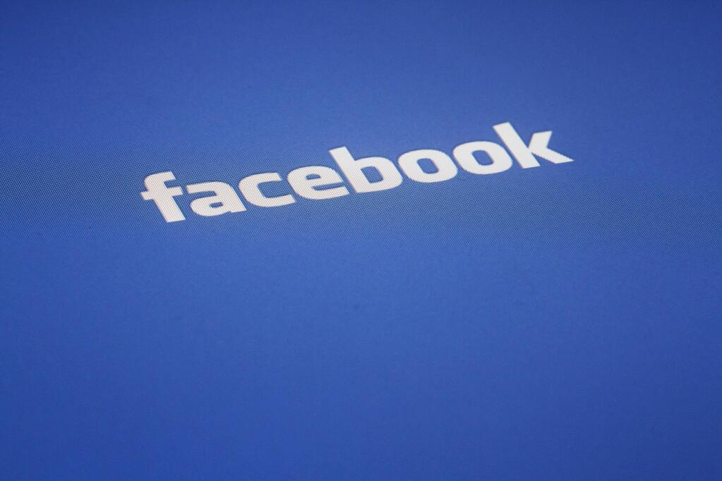 This May 16, 2012, file photo shows a Facebook logo displayed on the screen of an iPad in New York. (AP Photo/James H. Collins, File)