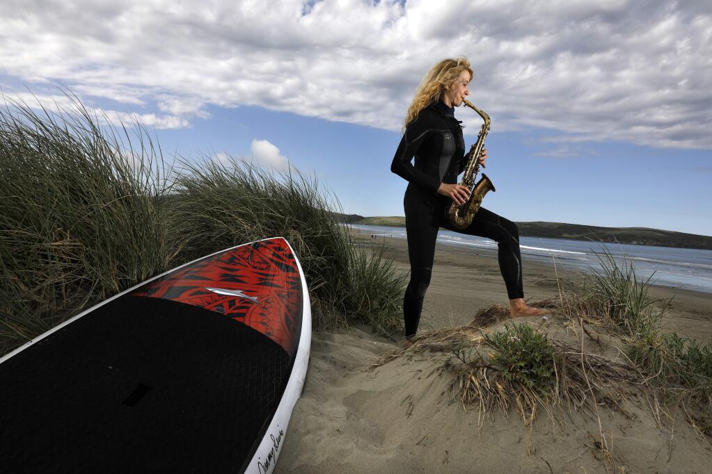 Susan Copperman, a saxophone player and member of the band Poyntlyss Sistars Rockin' Show Band, is also an avid surfer, music teacher and mother of two young girls, ages 3 and 5. Photo taken at Dillon Beach on Wednesday, May 16, 2018. (Beth Schlanker/ The Press Democrat)
