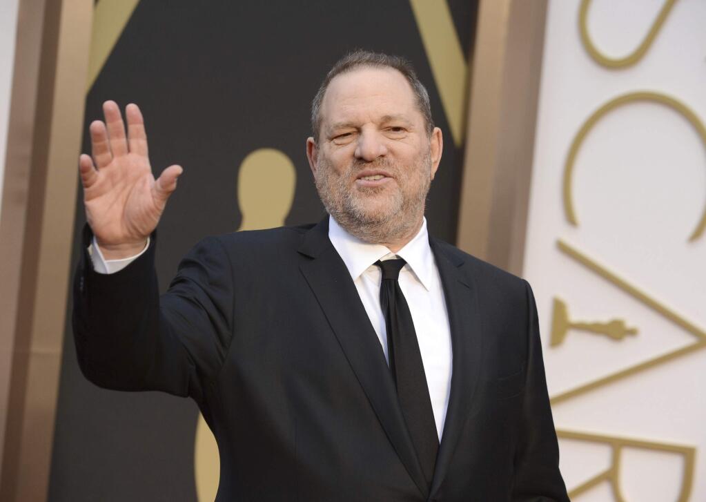 FILE - In this March 2, 2014 file photo, Harvey Weinstein arrives at the Oscars in Los Angeles. Disgraced movie mogul Harvey Weinstein's membership in the Academy of Motion Picture Arts and Sciences has been revoked by its board. The decision was reached Saturday, Oct. 14, 2017, in an emergency session. It comes after recent reports by The New York Times and The New Yorker that revealed sexual harassment and rape allegations against Weinstein going back decades. The move by the Academy is virtually unprecedented. (Photo by Jordan Strauss/Invision/AP, File)
