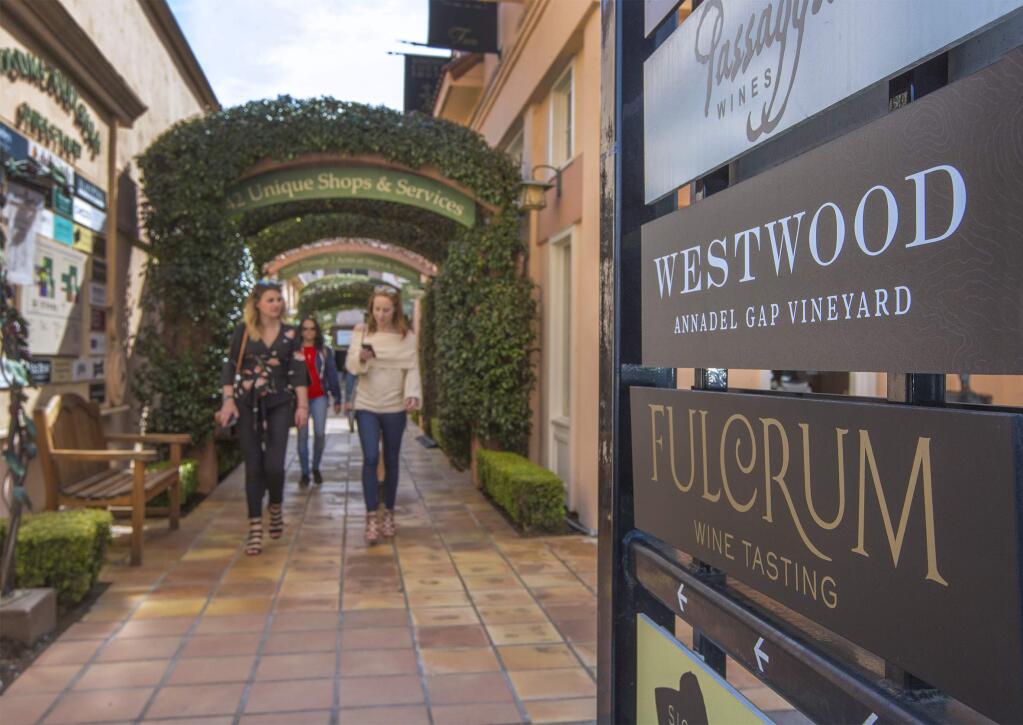The passageway on East Napa St. known as Vine Alley, which hosts the greatest concentration of tasting rooms on the Plaza. (Photo by Robbi Pengelly/Index-Tribune)