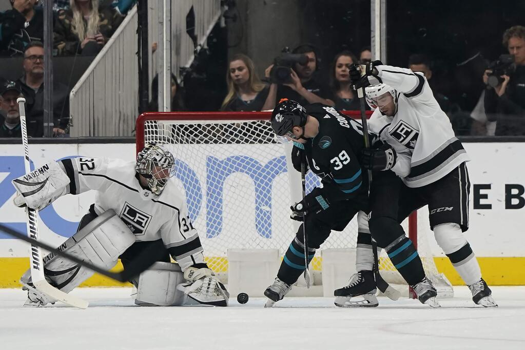 San Jose Sharks center Logan Couture, center, scores a goal past Los Angeles Kings goaltender Jonathan Quick during the second period in San Jose, Friday, Nov. 29, 2019. (AP Photo/Tony Avelar)